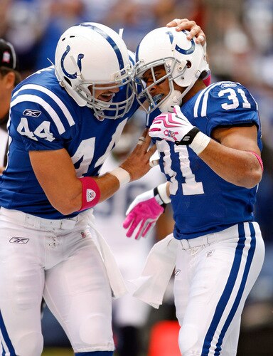 INDIANAPOLIS - OCTOBER 04: Dallas Clark #44 celebrates with Donald Brown #31 of the Indianapolis Colts after Brown ran for a touchdown during the NFL game against the Seattle Seahawks at Lucas Oil Stadium on October 4, 2009 in Indianapolis, Indiana. The Colts won 34-17.  <br /><br /><span class="help">(Photo by Andy Lyons/Getty Images)</span>