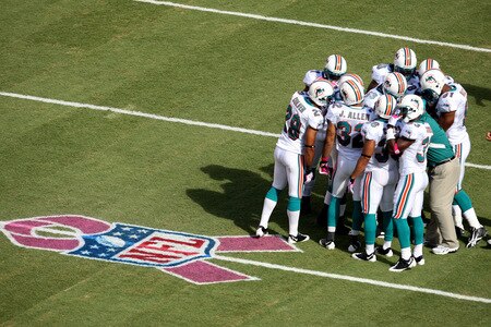 MIAMI - OCTOBER 04:  Miami Dolphins special team players prepare to kick off near a painted ribbon on the field for the NFL's 'A Crucial Catch",  in salute to breast cancer awareness month before taking on the Buffalo Bills at Land Shark Stadium on October 4, 2009 in Miami, Florida.  <br /><br /><span class="help">(Photo by Doug Benc/Getty Images)</span>