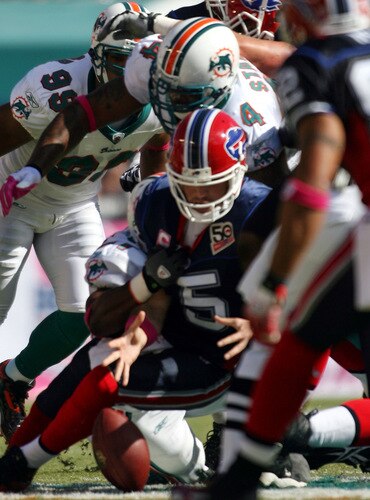 MIAMI - OCTOBER 04: Defensive end Jason Taylor #99 of the Miami Dolphins sacks Quarterback Trent Edwards #5 of the Buffalo Bills causing a fumble during the game at Land Shark Stadium on October 4, 2009 in Miami, Florida.  <br /><br /><span class="help">(Photo by Marc Serota/Getty Images)</span>