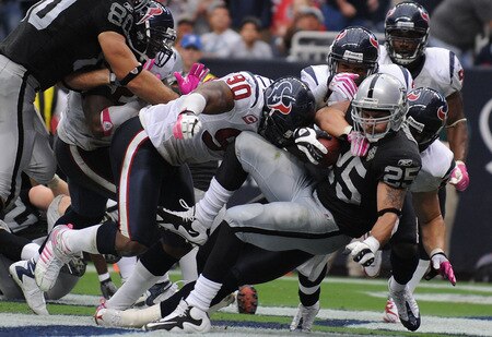 HOUSTON - OCTOBER 04:  Running back Justin Fargas #25 of the Oakland Raiders is tackled for a safety by Brian Cushing #56 of the Houston Texans at Reliant Stadium on October 4, 2009 in Houston, Texas.  <br /><br /><span class="help">(Photo by Ronald Martinez/Getty Images)</span>
