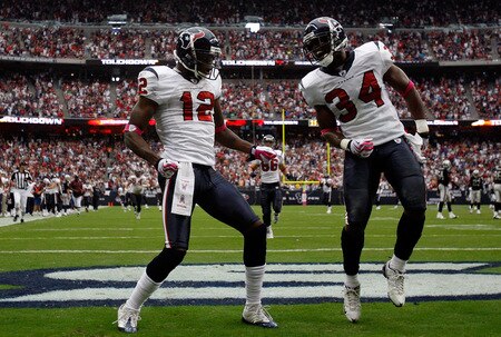 HOUSTON - OCTOBER 04:  Jacoby Jones #12 of the Houston Texans celebrates a kickoff return for a touchdown with Dominique Barber #34 during play against the Oakland Raiders at Reliant Stadium on October 4, 2009 in Houston, Texas.  <br /><br /><span class="help">(Photo by Ronald Martinez/Getty Images)</span>