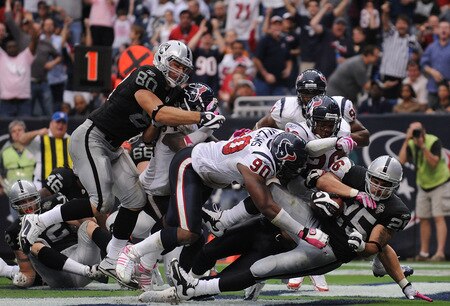 HOUSTON - OCTOBER 04:  Running back Justin Fargas #25 of the Oakland Raiders is tackled for a safety by Brian Cushing #56 of the Houston Texans at Reliant Stadium on October 4, 2009 in Houston, Texas.  <br /><br /><span class="help">(Photo by Ronald Martinez/Getty Images)</span>