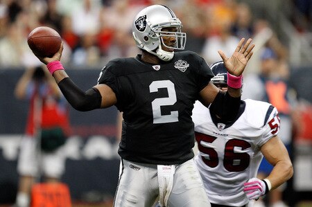 HOUSTON - OCTOBER 04:  Quarterback JaMarcus Russell #2 of the Oakland Raiders drops back to pass against the Houston Texans at Reliant Stadium on October 4, 2009 in Houston, Texas.  <br /><br /><span class="help">(Photo by Ronald Martinez/Getty Images)</span>