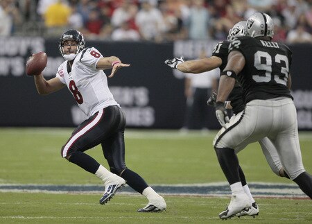 HOUSTON - OCTOBER 04:  Quarterback Matt Schaub #8 of the Houston Texans avoids pressure from defenive tackle Tommy Kelly #93 and Gerard Warren #61 of the Oakland Raiders at Reliant Stadium on October 4, 2009 in Houston, Texas.  <br /><br /><span class="help">(Photo by Bob Levey/Getty Images)</span>