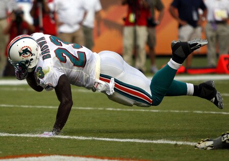 MIAMI - OCTOBER 04:  Running back Ronnie Brown #23 of the Miami Dolphins scores a touchdown against the Buffalo Bills at Land Shark Stadium on October 4, 2009 in Miami, Florida.  <br /><br /><span class="help">(Photo by Marc Serota/Getty Images)</span>
