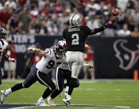 HOUSTON - OCTOBER 04:  Quarterback JeMarcus Russell #2 of the Oakland Raiders releases the ball  as he is pressured by defensive end Tim Bulman #93 of the Houston Texans at Reliant Stadium on October 4, 2009 in Houston, Texas.  <br /><br /><span class="help">(Photo by Bob Levey/Getty Images)</span>