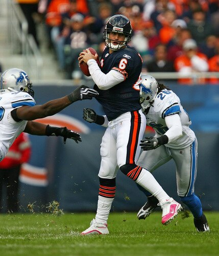 CHICAGO - OCTOBER 04: Jay Cutler #6 of the Chicago Bears is sacked by Cliff Avril #92 and Louis Delmas #26 of the Detroit Lions on October 4, 2009 at Soldier Field in Chicago, Illinois. The Bears defeated the Lions 48-24. <br /><br /><span class="help">(Photo by Jonathan Daniel/Getty Images)</span>