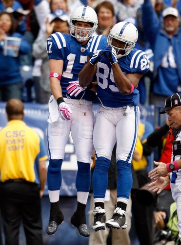 INDIANAPOLIS - OCTOBER 04:  Pierre Garcon #85 of the Indianapolis Colts and Autin Collie #17 celebrate a touchdown reception by Collie during the NFL game against the Seattle Seahawks at Lucas Oil Stadium on October 4, 2009 in Indianapolis, Indiana. The Colts won 34-17. Many players and officials in the NFL wore pink as part of breast cancer awareness month.  <br /><br /><span class="help">(Photo by Andy Lyons/Getty Images)</span>