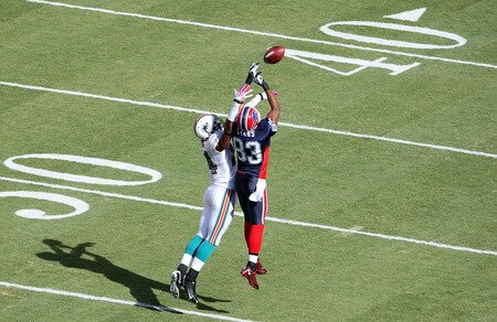 MIAMI - OCTOBER 04:  Cornerback Sean Smith #24 of the Miami Dolphins defends a pass intended for wide receiver Lee Evans #83 of the Buffalo Bills at Land Shark Stadium on October 4, 2009 in Miami, Florida.  <br /><br /><span class="help">(Photo by Doug Benc/Getty Images)</span>