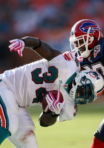 MIAMI - OCTOBER 04:  Running back Rickey Williams #34 of the Miami Dolphins is brought down by the Buffalo Bills at Land Shark Stadium on October 4, 2009 in Miami, Florida.  Miami defeated Buffalo 38-10. <br /><br /><span class="help">(Photo by Marc Serota/Getty Images)</span>