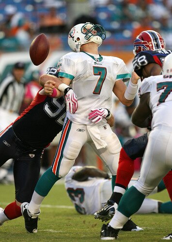 MIAMI - OCTOBER 04:  Defensive end Ryan Denney #92 of the Buffalo Bills causes quarterback Chad Henne #7 of the Miami Dolphins to fumble the ball in the fourth quarter at Land Shark Stadium on October 4, 2009 in Miami, Florida. The Dolphins defeated the Bills 38-10.  <br /><br /><span class="help">(Photo by Doug Benc/Getty Images)</span>