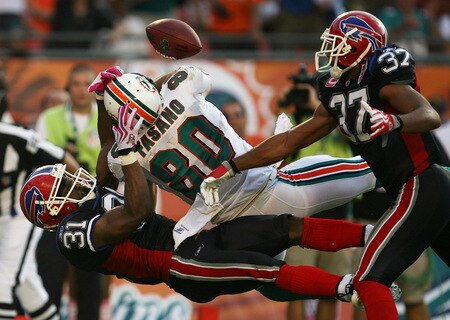 MIAMI - OCTOBER 04:  Defensive backs Jairus Byrd #31 and George Wilson #37 of the Buffalo Bills defend a pass attempt in the end-zone to tight end Anthony Fasano #80 of the Miami Dolphins at Land Shark Stadium on October 4, 2009 in Miami, Florida. The Dolphins defeated the Bills 38-10. Many players and officials in the NFL wore pink as part of breast cancer awareness month.  <br /><br /><span class="help">(Photo by Doug Benc/Getty Images)</span>