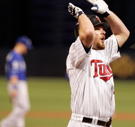 MINNEAPOLIS, MN - OCTOBER 4: Jason Kubel #16 of the Minnesota Twins celebrates after hitting a three-run home run against the Kansas City Royals in the first inning at Hubert H. Humphrey Metrodome on October 4, 2009 in Minneapolis, Minnesota. <br /><br /><span class="help">(Photo by Genevieve Ross/Getty Images) )</span>