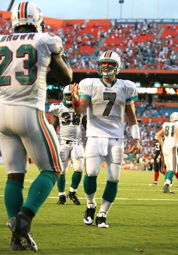MIAMI - OCTOBER 04:  Quarterback Chad Henne #7 of the Miami Dolphins runs to celebrate with running back Ronnie Brown #23 after Brown's touchdown run in the fourth quarter against the Buffalo Bills at Land Shark Stadium on October 4, 2009 in Miami, Florida. The Dolphins defeated the Bills 38-10.  <br /><br /><span class="help">(Photo by Doug Benc/Getty Images)</span>