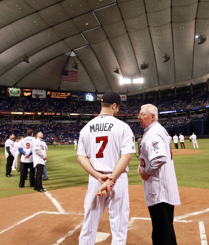 MINNEAPOLIS, MN - OCTOBER 4: Former Minnesota Twins manager Tom Kelly talks with current player Joe Mauer during a tribute to the Hubert H. Humphrey Metrodome on October 4, 2009 in Minneapolis, Minnesota. The post-game ceremony marked the end of regular season baseball inside the Dome. <br /><br /><span class="help">(Photo by Genevieve Ross/Getty Images)</span>