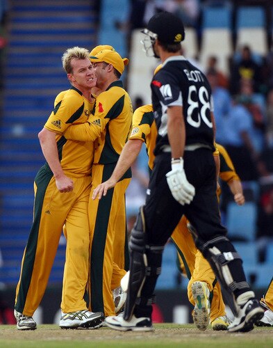 CENTURION, SOUTH AFRICA - OCTOBER 05:  Grant Elliot of New Zealand walks past a jubillant Brett Lee of Australia after his dismissal during the ICC Champions Trophy Final between Australia and New Zealand played at Supersport Park on October 5, 2009 in Centurion, South Africa.  <br /><br /><span class="help">(Photo by Julian Herbert/Getty Images)</span>