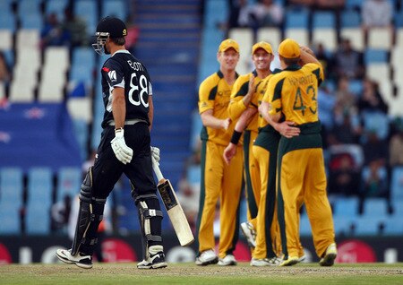 CENTURION, SOUTH AFRICA - OCTOBER 05: Grant Elliot of New Zealand walks past jubillant Australian players after his dismissal during the ICC Champions Trophy Final between Australia and New Zealand played at Supersport Park on October 5, 2009 in Centurion, South Africa.  <br /><br /><span class="help">(Photo by Julian Herbert/Getty Images)</span>