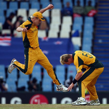 CENTURION, SOUTH AFRICA - OCTOBER 05:  Cameron White leaps to join team mate Brett Lee in celebrating the wicket of New Zealand's Grant Elliot during the ICC Champions Trophy Final between Australia and New Zealand played at Supersport Park on October 5, 2009 in Centurion, South Africa.  <br /><br /><span class="help">(Photo by Julian Herbert/Getty Images)</span>