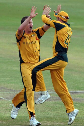 CENTURION, SOUTH AFRICA - OCTOBER 05:  Peter Siddle of Australia and Mike Hussey of Australia celebrate the wicket of Brendon McCullum of New Zealand during the ICC Champions Trophy final match between Australia and New Zealand from SuperSport Park on October 05, 2009 in Centurion, South Africa. <br /><br /><span class="help">(Photo by Lee Warren/Gallo Images/Getty Images)</span>