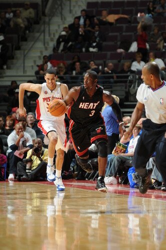 AUBURN HILLS, MI - OCTOBER 5:  Dwyane Wade #3 of the Miami Heat drives up court past Austin Daye #5 of the Detroit Pistons in a preseason game at the Palace of Auburn Hills on October 5, 2009 in Auburn Hills, Michigan.  <br /><br /><span class="help">(Photo by D. Lippitt/Einstein/NBAE via Getty Images)</span>
