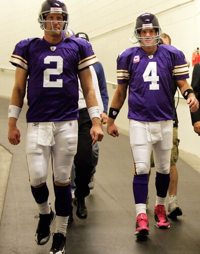 MINNEAPOLIS - OCTOBER 05:  Quarterback Brett Favre #4 of the Minnesota Vikings walks out of the tunnel alongside Sage Rosenfels #2 prior to the start of the game against the Green Bay Packers on October 5, 2009 at Hubert H. Humphrey Metrodome in Minneapolis, Minnesota.  <br /><br /><span class="help">(Photo by Jamie Squire/Getty Images)</span>