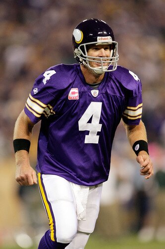 MINNEAPOLIS - OCTOBER 05:  Quarterback Brett Favre #4 of the Minnesota Vikings celebrates after a touchdown during the game against the Green Bay Packers on October 5, 2009 at Hubert H. Humphrey Metrodome in Minneapolis, Minnesota.  <br /><br /><span class="help">(Photo by Jamie Squire/Getty Images)</span>