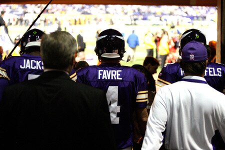 MINNEAPOLIS - OCTOBER 05:  Quarterback Brett Favre #4 of the Minnesota Vikings walks out of the tunnel onto the field prior to the start of the game against the Green Bay Packers on October 5, 2009 at Hubert H. Humphrey Metrodome in Minneapolis, Minnesota.  <br /><br /><span class="help">(Photo by Jamie Squire/Getty Images)</span>