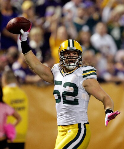 MINNEAPOLIS - OCTOBER 05:  Linebacker Clay Matthews #52 of the Green Bay Packers celebrates after running back an interception for a touchdown during the game against  the Minnesota Vikings on October 5, 2009 at Hubert H. Humphrey Metrodome in Minneapolis, Minnesota.  <br /><br /><span class="help">(Photo by Jamie Squire/Getty Images)</span>