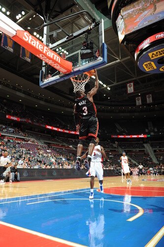 AUBURN HILLS, MI - OCTOBER 5:  Dwyane Wade #3 of the Miami Heat goes up for a reverse dunk past Rodney Stuckey #3 of the Detroit Pistons in a preseason game at the Palace of Auburn Hills on October 5, 2009 in Auburn Hills, Michigan.  <br /><br /><span class="help">(Photo by D. Lippitt/Einstein/NBAE via Getty Images)</span>
