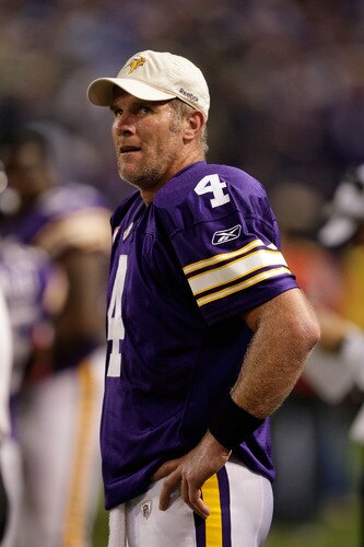 MINNEAPOLIS - OCTOBER 05:  Quarterback Brett Favre #4 of the Minnesota Vikings watches the reply from the sidelines after a touchdown during the game against the Green Bay Packers on October 5, 2009 at Hubert H. Humphrey Metrodome in Minneapolis, Minnesota.  <br /><br /><span class="help">(Photo by Jamie Squire/Getty Images)</span>