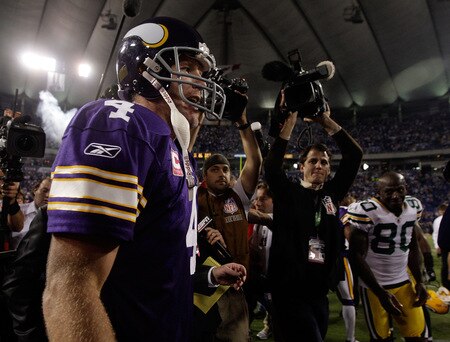 MINNEAPOLIS - OCTOBER 05:  Quarterback Brett Favre #4 of the Minnesota Vikings walks off the field as former teammate Donald Driver #80 of the Green Bay Packers seeks him out following the Vikings victory over the Packers on October 5, 2009 at Hubert H. Humphrey Metrodome in Minneapolis, Minnesota.  <br /><br /><span class="help">(Photo by Jamie Squire/Getty Images)</span>