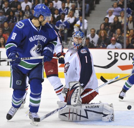 VANCOUVER, CANADA - OCTOBER 5:  Steve Mason #1 of the Columbus Blue Jackets looks toward the referee to see if it's a goal as the puck bounces out of his net while Steve Bernier #18 of the Vancouver Canucks looks on during their game at General Motors Place October 5, 2009 in Vancouver, Canada.   <br /><br /><span class="help">(Photo by Nick Didlick/Getty Images)</span>