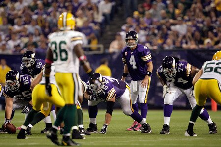 MINNEAPOLIS - OCTOBER 05:  Quarterback Brett Favre #4 of the Minnesota Vikings lines up during the Monday Night Football game against the Green Bay Packers on October 5, 2009 at Hubert H. Humphrey Metrodome in Minneapolis, Minnesota.  <br /><br /><span class="help">(Photo by Jamie Squire/Getty Images)</span>