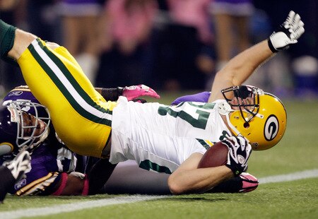 MINNEAPOLIS - OCTOBER 05:  Receiver Jordy Nelson #87 of the Green Bay Packers is tackled into the endzone for a touchdown during the Monday Night Football game against the Minnesota Vikings on October 5, 2009 at Hubert H. Humphrey Metrodome in Minneapolis, Minnesota.  <br /><br /><span class="help">(Photo by Jamie Squire/Getty Images)</span>