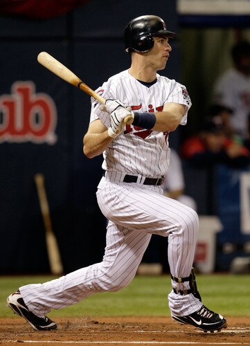 MINNEAPOLIS - OCTOBER 06:  Joe Mauer #7 of the Minnesota Twins doubles during the 1st inning of the American League Tiebreaker game against the Detroit Tigers on October 6, 2009 at Hubert H. Humphrey Metrodome in Minneapolis, Minnesota.  <br /><br /><span class="help">(Photo by Jamie Squire/Getty Images)</span>
