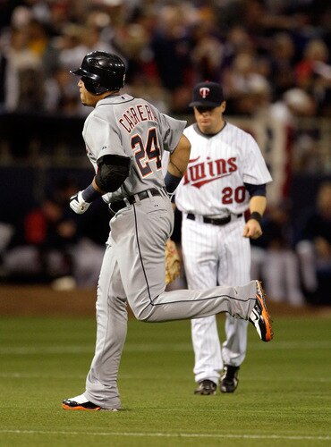 MINNEAPOLIS - OCTOBER 06:  Miguel Cabrera #24 of the Detroit Tigers rounds the bases after hitting a home run as Matt Tolbert #20 of the Minnesota Twins looks on during the 3rd inning of the American League Tiebreaker game on October 6, 2009 at Hubert H. Humphrey Metrodome in Minneapolis, Minnesota.  <br /><br /><span class="help">(Photo by Jamie Squire/Getty Images)</span>