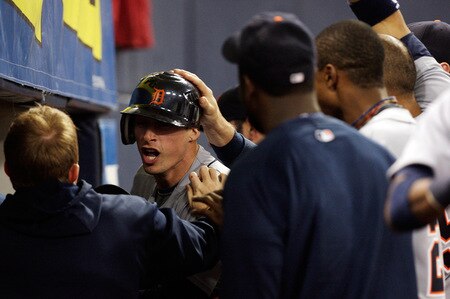 MINNEAPOLIS - OCTOBER 06:  Don Kelly #32 of the Detroit Tigers is congratulated by teammates after sliding safely into home plate to score during the 10th inning of the American League Tiebreaker game against  the Minnesota Twins on October 6, 2009 at Hubert H. Humphrey Metrodome in Minneapolis, Minnesota.  <br /><br /><span class="help">(Photo by Jamie Squire/Getty Images)</span>