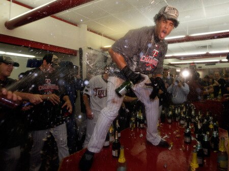 MINNEAPOLIS - OCTOBER 06:  Carlos Gomez #22 of the Minnesota Twins celebrates with teammates in the locker room after the Twins defeated  the Detroit Tigers to win the American League Tiebreaker game on October 6, 2009 at Hubert H. Humphrey Metrodome in Minneapolis, Minnesota.  <br /><br /><span class="help">(Photo by Jamie Squire/Getty Images)</span>
