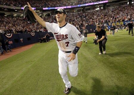 MINNEAPOLIS - OCTOBER 06:  Joe Mauer #7 of the Minnesota Twins circles the field after the Twins defeated  the Detroit Tigers to win the American League Tiebreaker game on October 6, 2009 at Hubert H. Humphrey Metrodome in Minneapolis, Minnesota.  <br /><br /><span class="help">(Photo by Jamie Squire/Getty Images)</span>