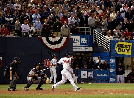 MINNEAPOLIS - OCTOBER 06:  Alexi Casilla #25 of the Minnesota Twins hits the game-winning hit as the Twins defeat the Detroit Tigers to win the American League Tiebreaker game on October 6, 2009 at Hubert H. Humphrey Metrodome in Minneapolis, Minnesota.  <br /><br /><span class="help">(Photo by Jamie Squire/Getty Images)</span>