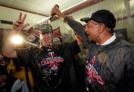 MINNEAPOLIS - OCTOBER 06:  Joe Mauer #7 of the Minnesota Twins celebrates with teammates in the locker room after the Twins defeated  the Detroit Tigers to win the American League Tiebreaker game on October 6, 2009 at Hubert H. Humphrey Metrodome in Minneapolis, Minnesota.  <br /><br /><span class="help">(Photo by Jamie Squire/Getty Images)</span>