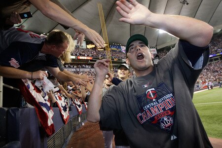 MINNEAPOLIS - OCTOBER 06:   Minnesota Twins players celebrate with fans after the Twins defeated  the Detroit Tigers to win the American League Tiebreaker game on October 6, 2009 at Hubert H. Humphrey Metrodome in Minneapolis, Minnesota.  <br /><br /><span class="help">(Photo by Jamie Squire/Getty Images)</span>