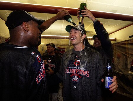 MINNEAPOLIS - OCTOBER 06:  Starting pitcher Scott Baker of the Minnesota Twins is doused with champagne as he celebrates with teammates in the locker room after the Twins defeated  the Detroit Tigers to win the American League Tiebreaker game on October 6, 2009 at Hubert H. Humphrey Metrodome in Minneapolis, Minnesota.  <br /><br /><span class="help">(Photo by Jamie Squire/Getty Images)</span>