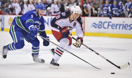 VANCOUVER, CANADA - OCTOBER 5:  Christian Ehrhoff #5 of the Vancouver Canucks tries to catch R.J. Umberger #18 of the Columbus Blue Jackets during his break away at their game at General Motors Place October 5, 2009 in Vancouver, Canada.   <br /><br /><span class="help">(Photo by Nick Didlick/Getty Images)</span>