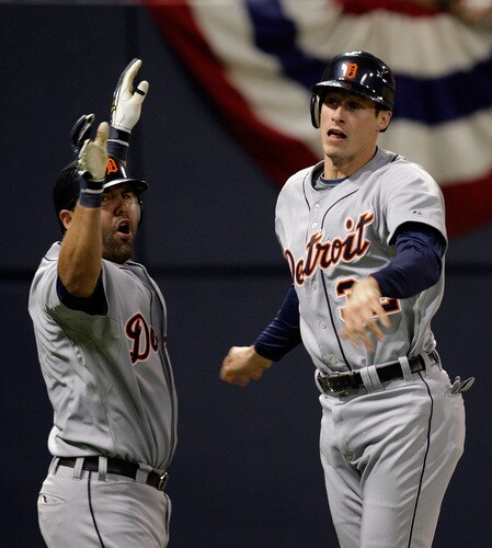 MINNEAPOLIS - OCTOBER 06:  Don Kelly #32 of the Detroit Tigers celebrates with Gerald Liard #8 after sliding safely into home plate to score during the 10th inning of the American League Tiebreaker game against  the Minnesota Twins on October 6, 2009 at Hubert H. Humphrey Metrodome in Minneapolis, Minnesota.  <br /><br /><span class="help">(Photo by Jamie Squire/Getty Images)</span>