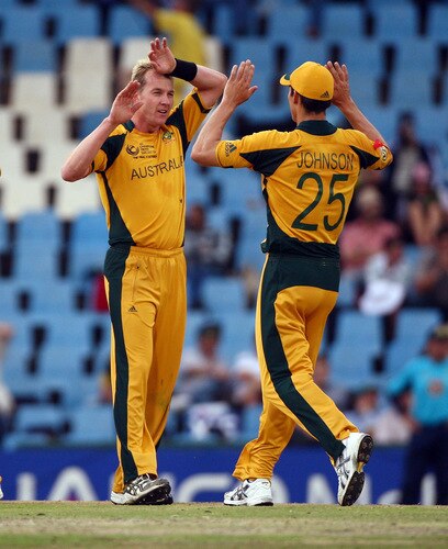 CENTURION, SOUTH AFRICA - OCTOBER 05:  Mitchell Johnson joins team mate Brett Lee in celebrating the wicket of New Zealand's Grant Elliot during the ICC Champions Trophy Final between Australia and New Zealand played at Supersport Park on October 5, 2009 in Centurion, South Africa.  <br /><br /><span class="help">(Photo by Julian Herbert/Getty Images)</span>