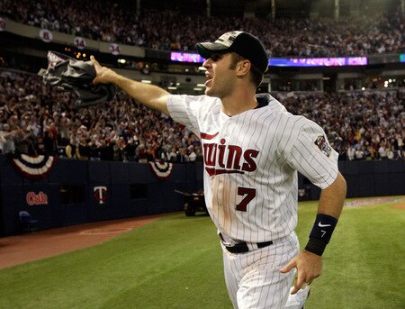 MINNEAPOLIS - OCTOBER 06:  Joe Mauer #7 of the Minnesota Twins circles the field after the Twins defeated  the Detroit Tigers to win the American League Tiebreaker game on October 6, 2009 at Hubert H. Humphrey Metrodome in Minneapolis, Minnesota.  <br /><br /><span class="help">(Photo by Jamie Squire/Getty Images)</span>