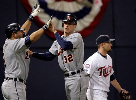 MINNEAPOLIS - OCTOBER 06:  Don Kelly #32 of the Detroit Tigers celebrates with Gerald Liard #8 after sliding safely into home plate to score during the 10th inning of the American League Tiebreaker game against  the Minnesota Twins on October 6, 2009 at Hubert H. Humphrey Metrodome in Minneapolis, Minnesota.  <br /><br /><span class="help">(Photo by Jamie Squire/Getty Images)</span>