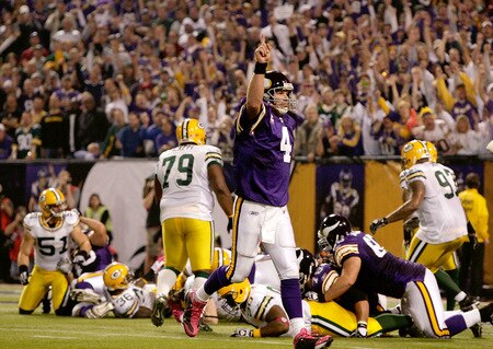 MINNEAPOLIS - OCTOBER 05:  Quarterback Brett Favre #4 of the Minnesota Vikings celebrates after a touchdown during the game against the Green Bay Packers on October 5, 2009 at Hubert H. Humphrey Metrodome in Minneapolis, Minnesota.  <br /><br /><span class="help">(Photo by Jamie Squire/Getty Images)</span>