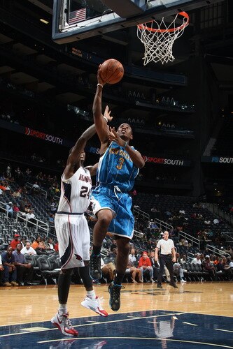 ATLANTA - OCTOBER 7: Chris Paul #3 of the New Orleans Hornets puts up a shot against Marvin Williams #24 of the Atlanta Hawks during a preseason game on October 7, 2009 at Philips Arena in Atlanta, Georgia.  <br /><br /><span class="help">(Photo by Scott Cunningham/NBAE via Getty Images)</span>